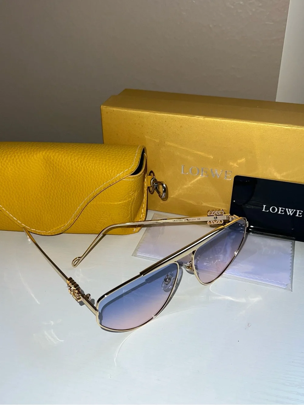 Loewe Gold Frame Sunglasses with Gradient Blue-Purple Lenses